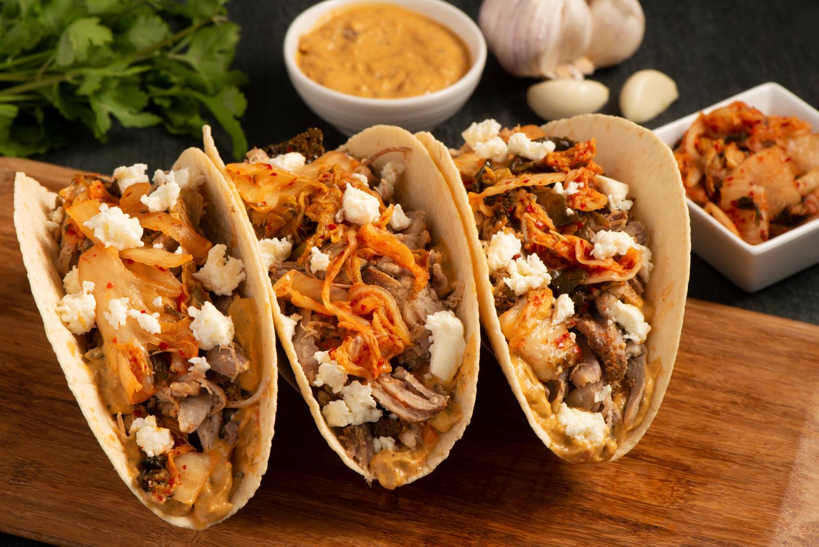 slow-roasted-pork-taco-with-red-curry-coconut-spread-kimchi-and-queso-fresco_compressed