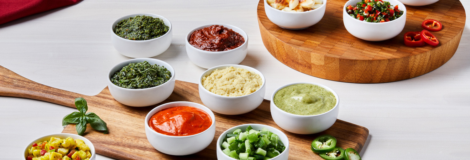 Colorful assortment of frozen salsas, herbs, ethnic sauces, and pureed vegetables