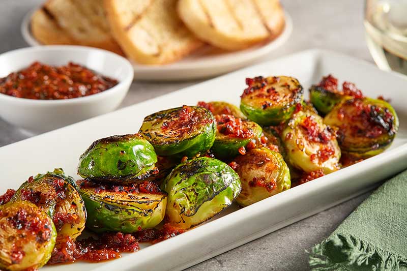 Crispy Brussels Sprouts, Tuscan Tomato ‘Nduja Vinaigrette